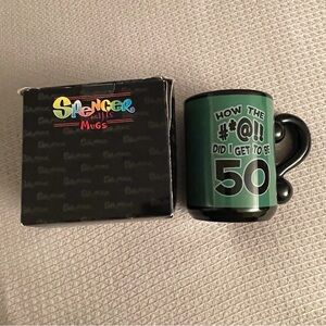 Spencer's Black and Green “How the #*@!! Did I get to be 50” humor mug